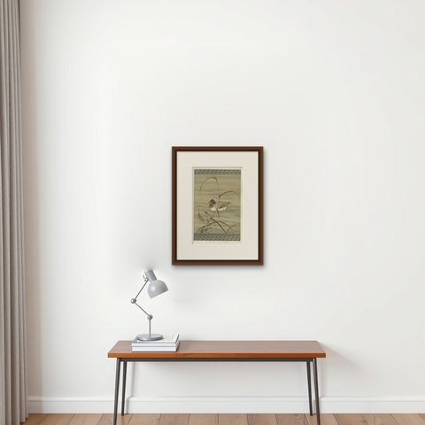 Antique Japanese Waterfowl Print: Tranquil Duck in Reeds, 19th Century, shown framed on a wall