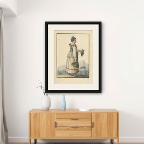 Antique Print of a Woman Harvesting Grapes 'circa 1880', shown framed on a wall