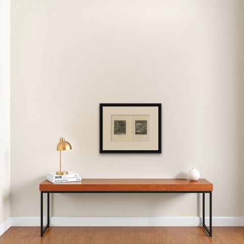 Set of 2 Antique Prints of a Lioness Hunting and Resting, shown framed on a wall